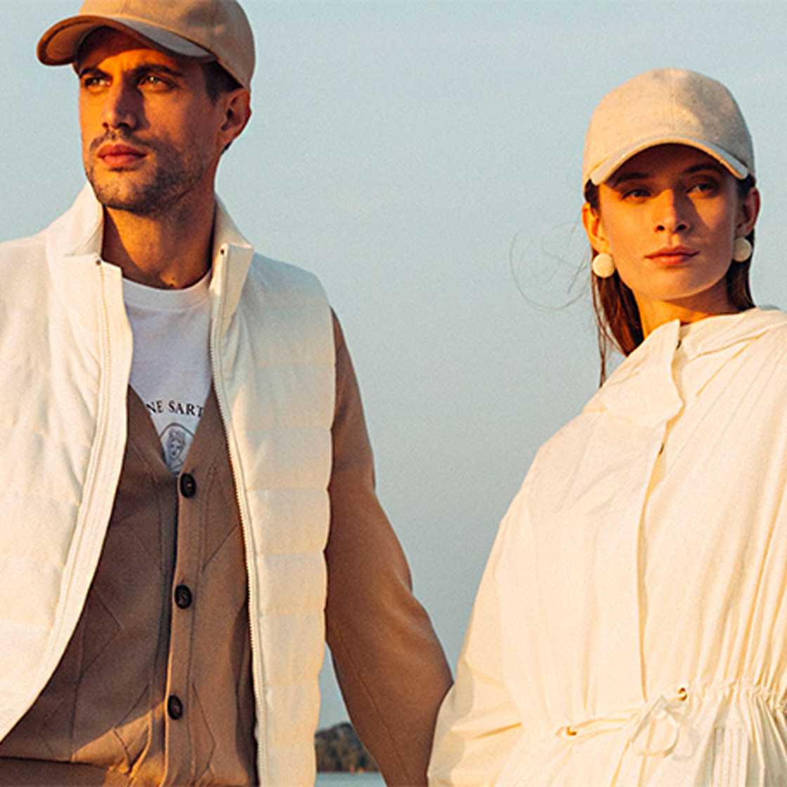 man and women wearing clothes and caps