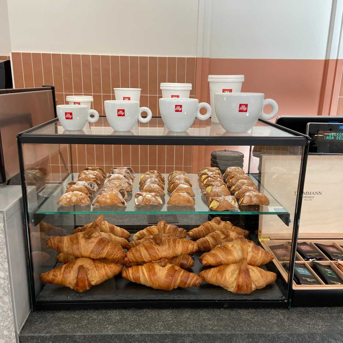 Image of pastries and coffee mugs