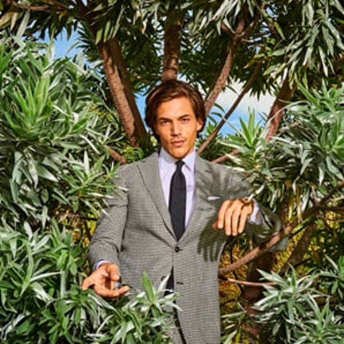 man in a checked suit