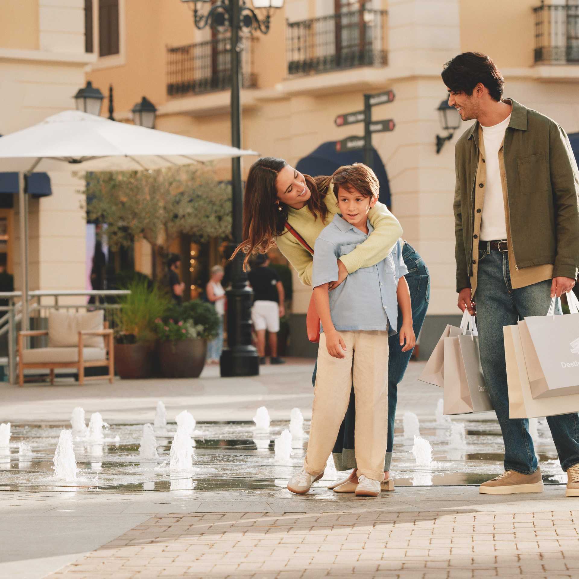 Family by the fountain in the main square