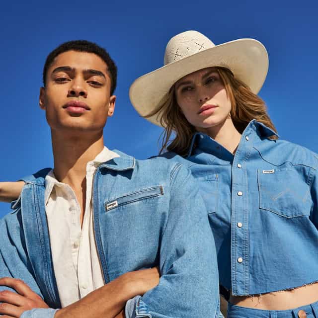 Image of a couple wearing Wrangler jeans.