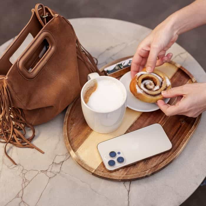 Cup of coffee and handbag