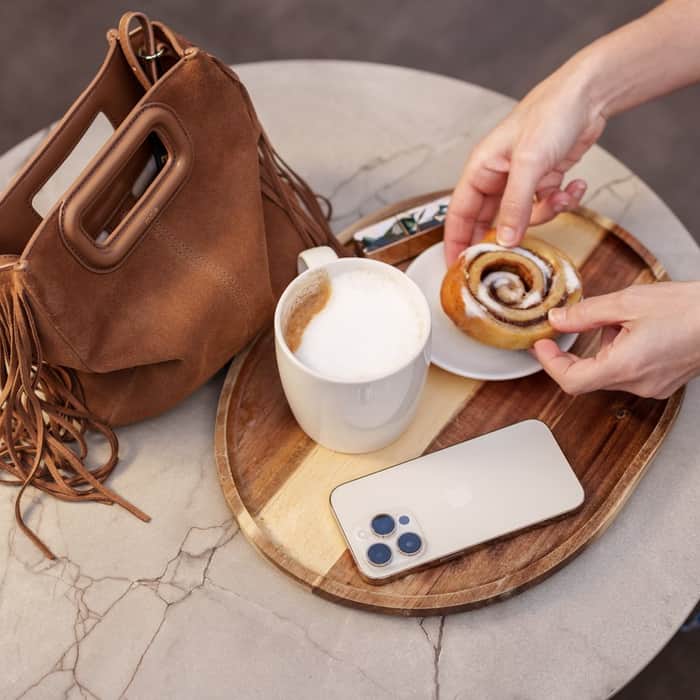 Cup of coffee and handbag