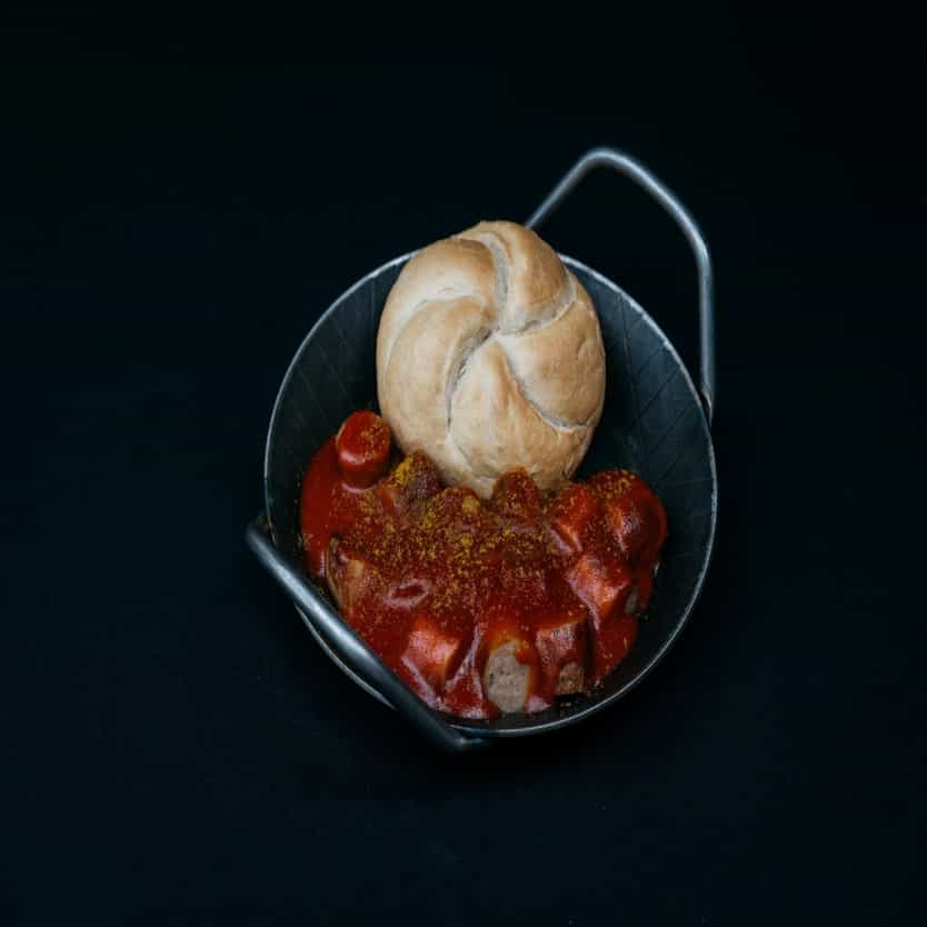 Curry Sausage with sauce in a pan