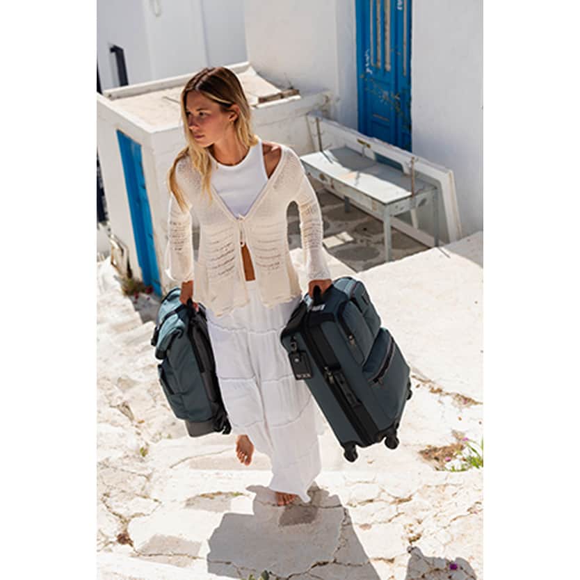 Tumi woman with luggage