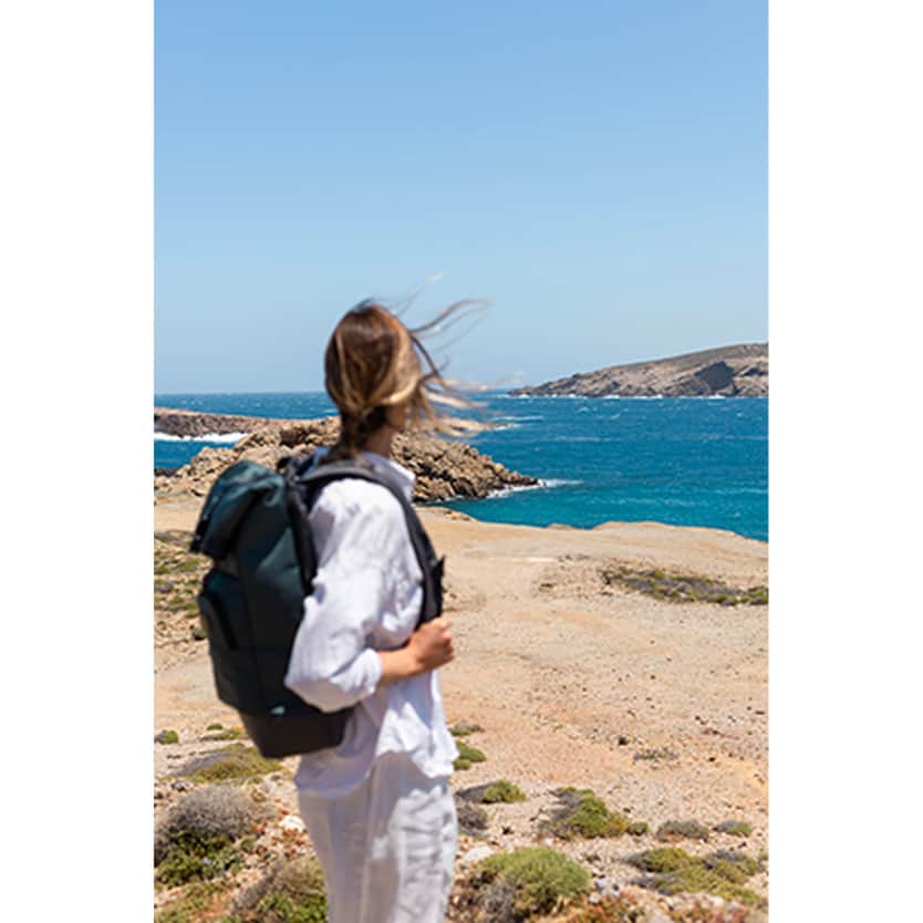 Tumi woman with backpack