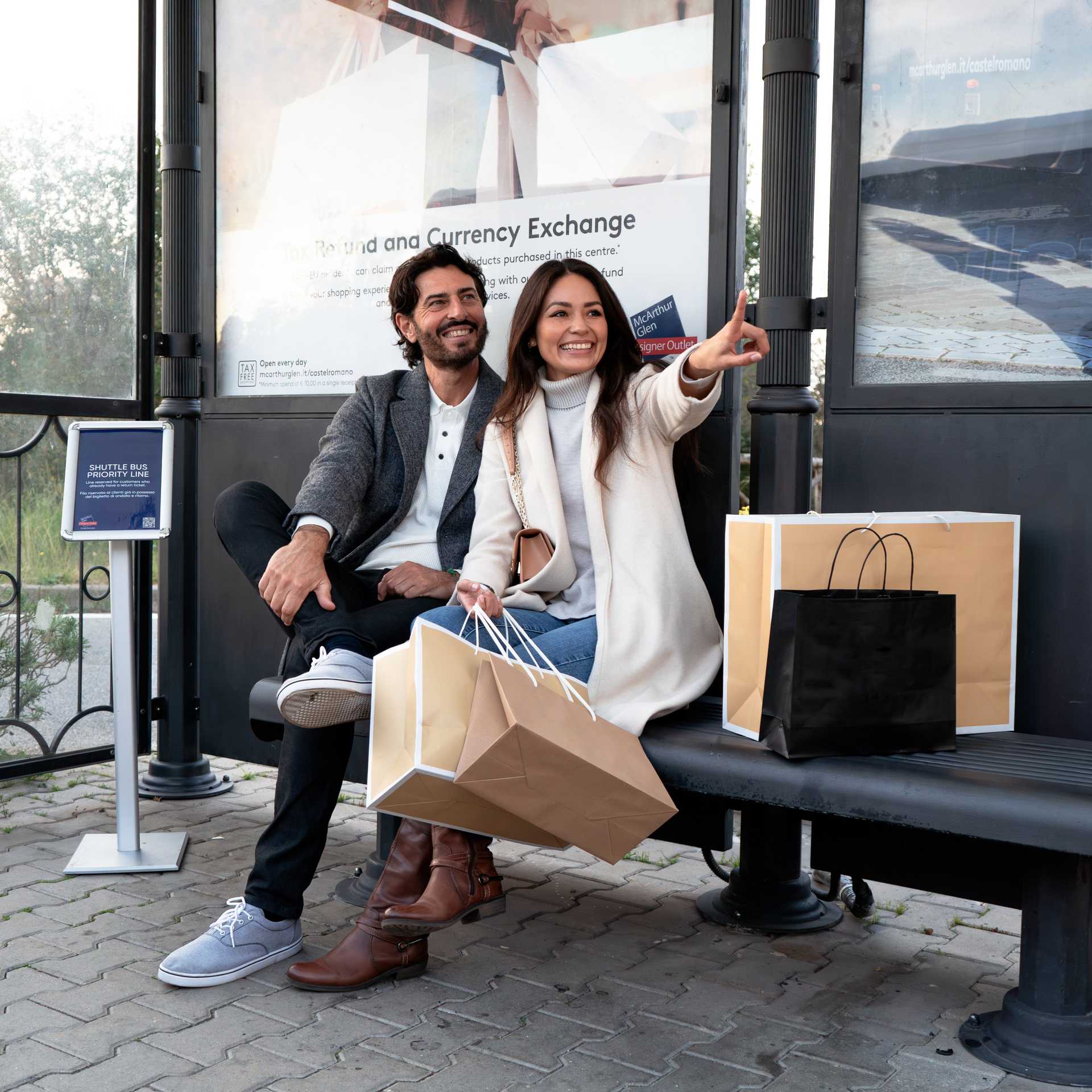 man and women waiting for the shuttle bus