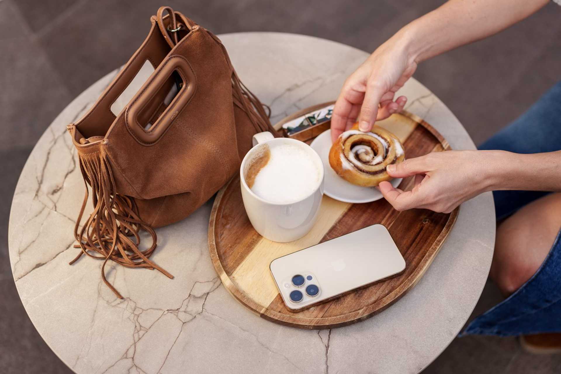 Cup of coffee and handbag