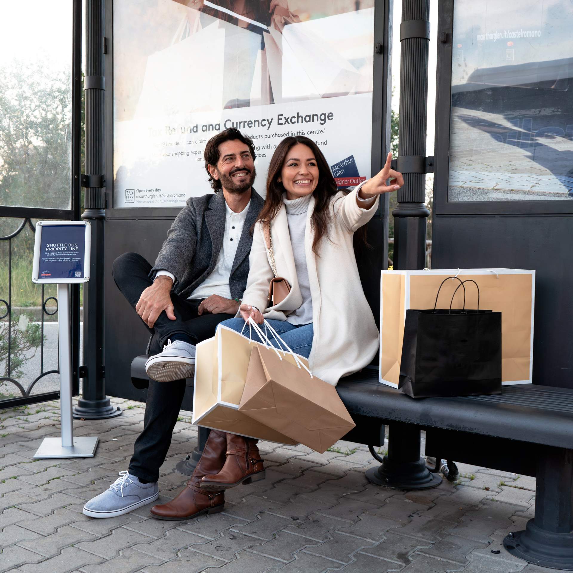 man and women waiting for the shuttle bus