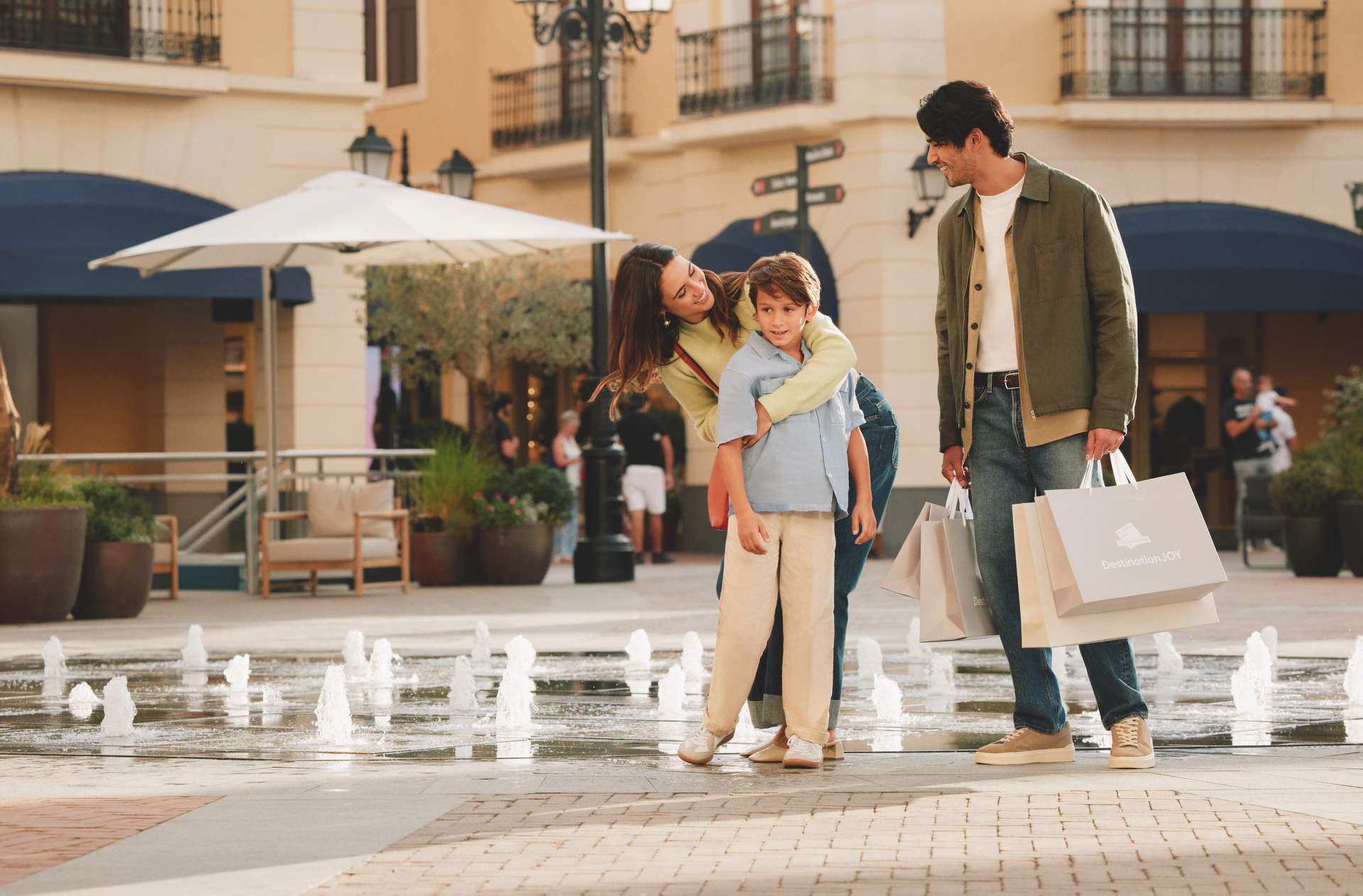 Family by the fountain in the main square
