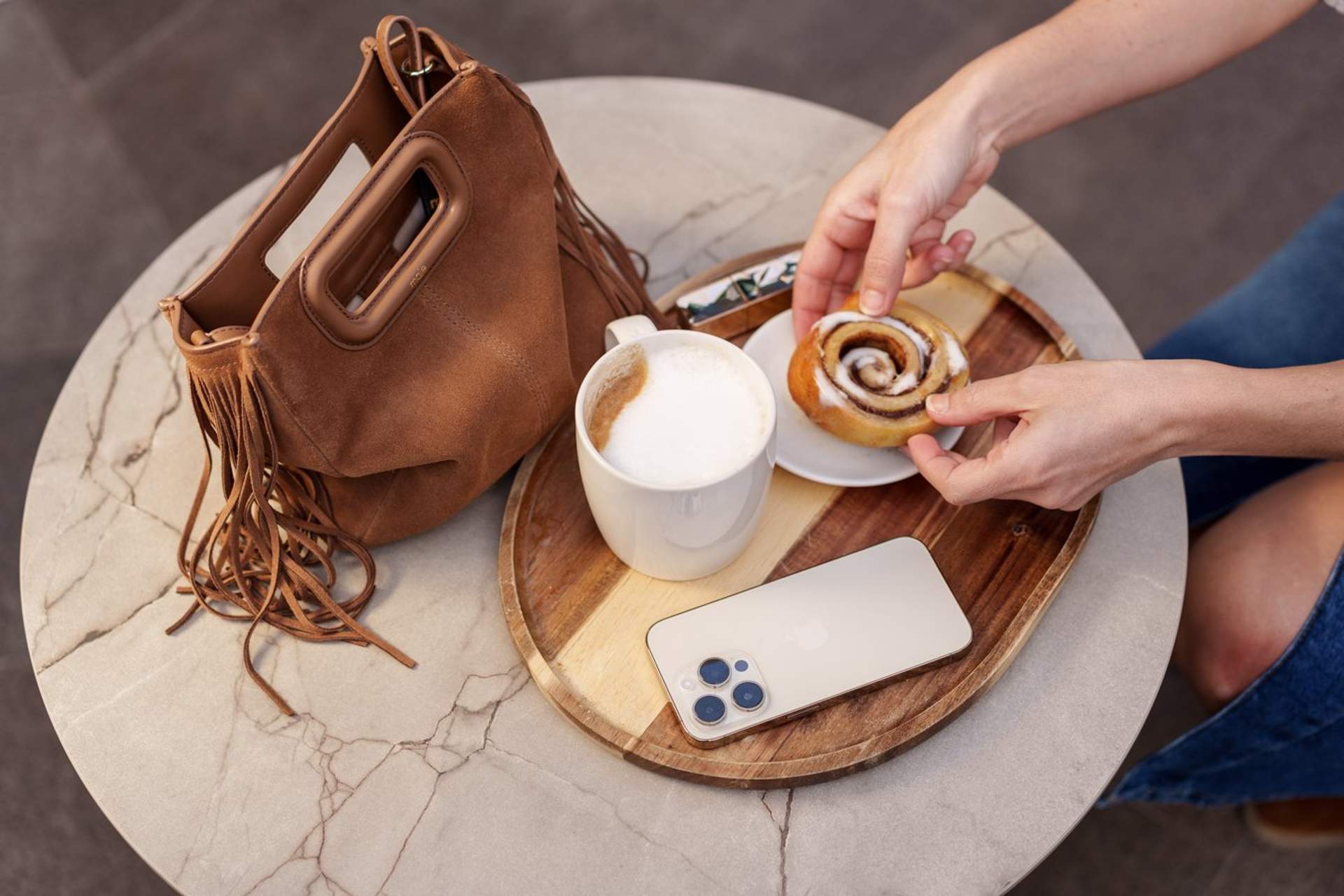 Cup of coffee and handbag