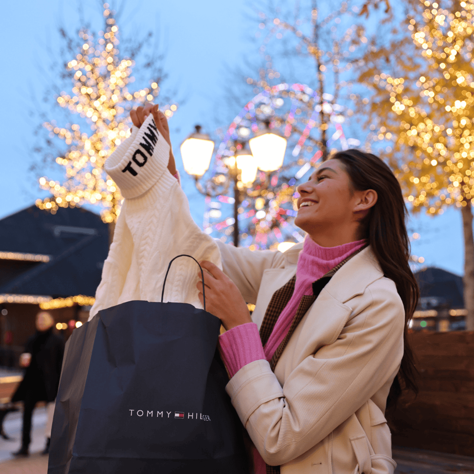 Young woman admiring her new Tommy Hilfiger Sweater