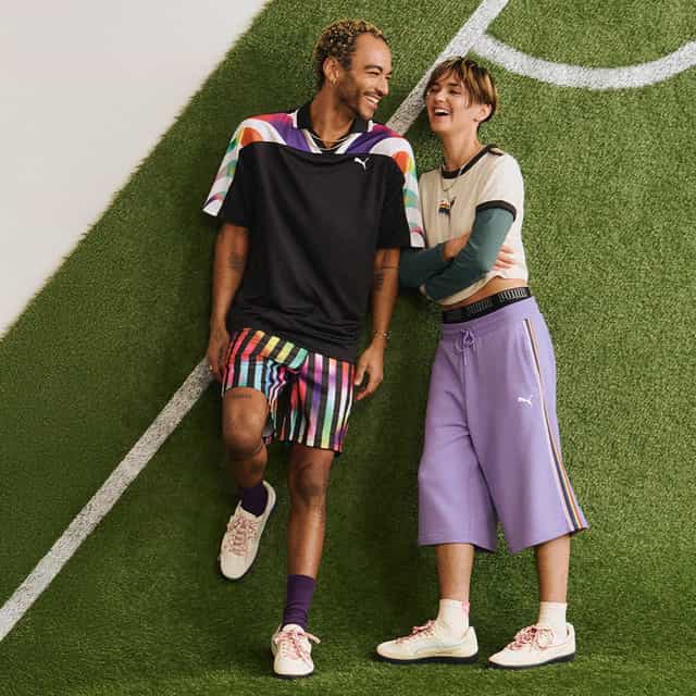 Two people lying down on the grass.